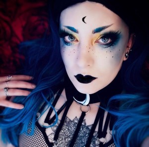 Alt goth self portrait photograph featuring blue and gold makeup 