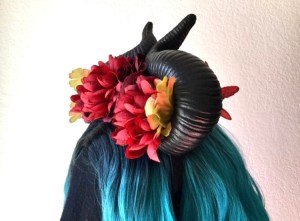Horned headdress with red flowers 
