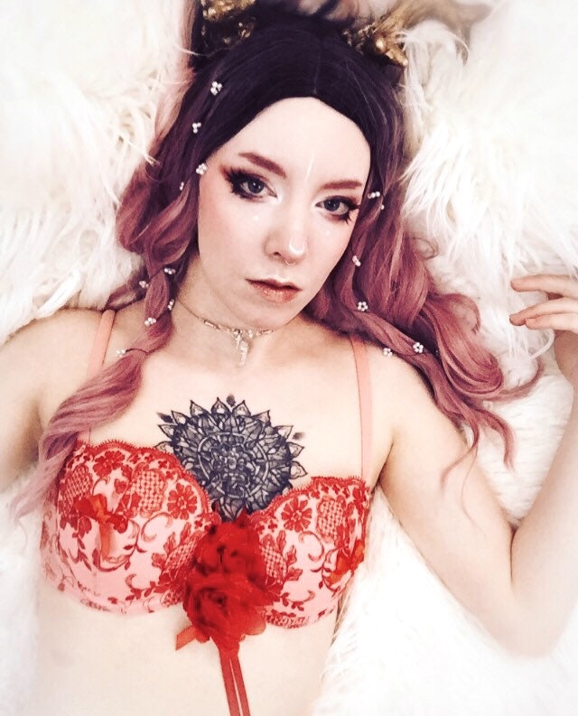 LGBTQ model wearing a reworked, up-cycled floral lace bra that’s available in the BlessedShadows Etsy shop 